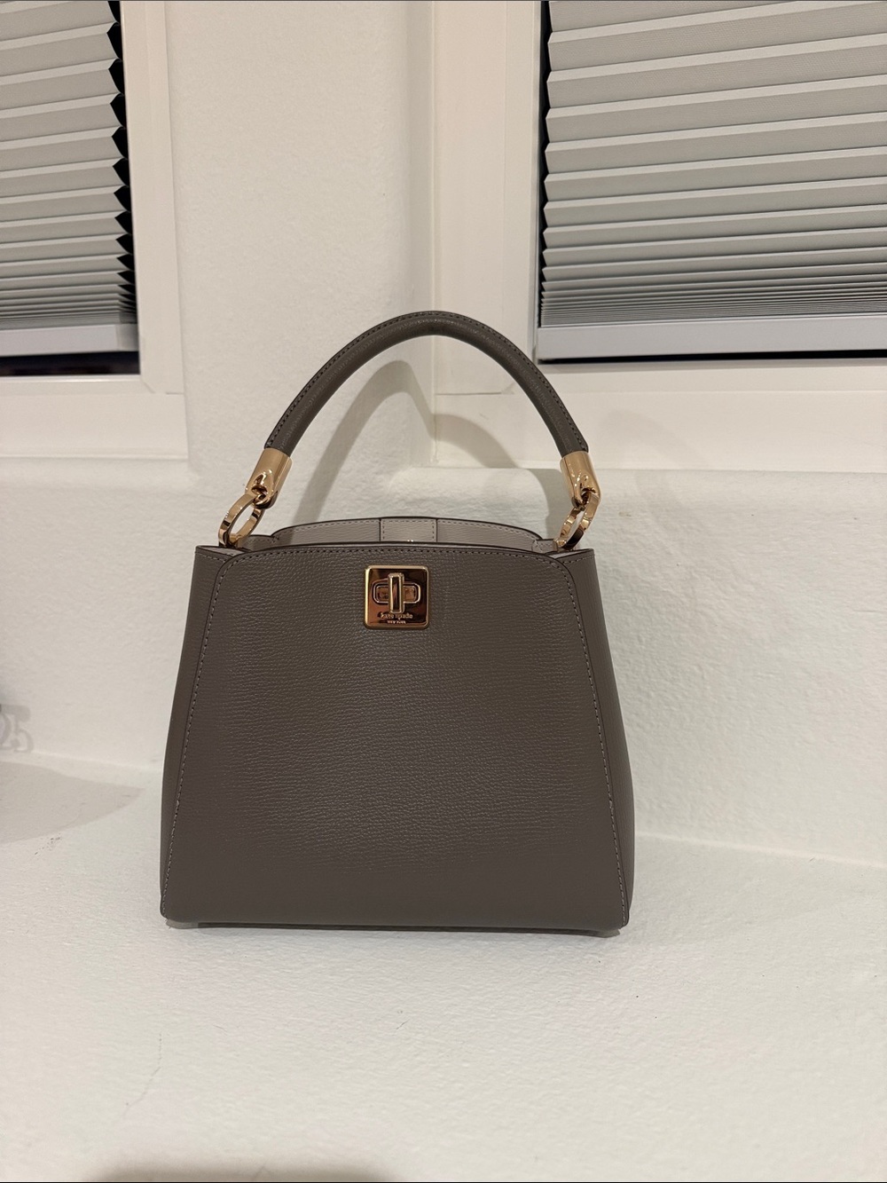 NWOT kate spade taupe structured top-handle bag with gold hardware